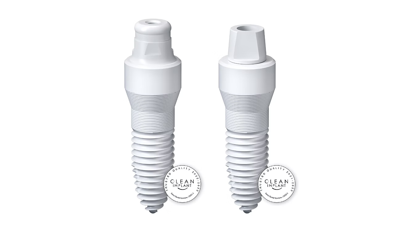Two white zirconia dental implant fixtures with Clean Implant trusted quality certification